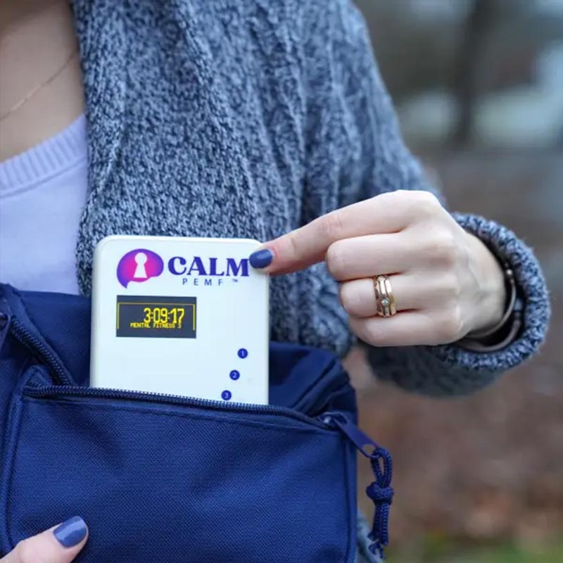 Calm PEMF - PEMF Device being pulled out of shoulder bag