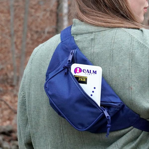 Calm PEMF - PEMF Device in bag worn across shoulder on back
