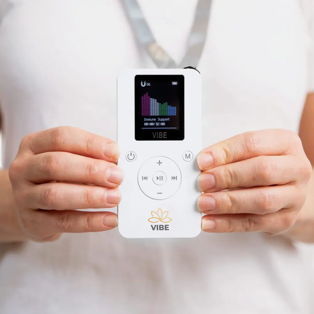 Resona Vibe PEMF device being held out while being worn on lanyard 