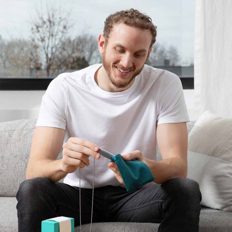 Resona Health VaguVibe being placed in storage bag